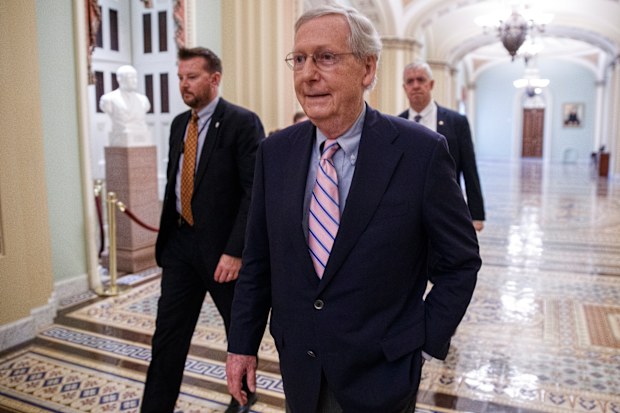 Senate Majority Leader Mitch McConnell walks off the Senate floor following the Senate confirmation of Supreme Court nominee Brett Kavanaugh in the US Capitol in Washington