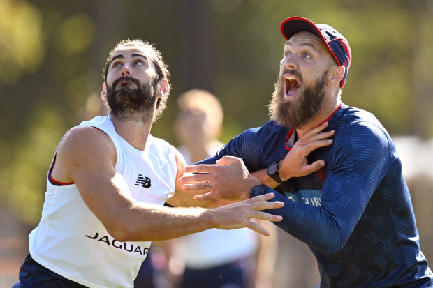 MELBOURNE, AUSTRALIA - MARCH 17: Brodie Grundy and Max Gawn of the Demons compete in the ruck during a Melbourne Demons AFL training session at Gosch's Paddock on March 17, 2023 in Melbourne, Australia. (Photo by Morgan Hancock/Getty Images)