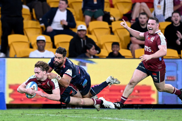 Tim Ryan of the Reds scores a try during the round 12 Super Rugby Pacific match between Queensland Reds and Melbourne Rebels.