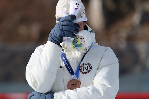 Bronze medalist Sturla Holm Laegreid of Team Norway on the podium during the medal ceremony for the Men's 20km Individual on day four of Milano Cortina 2026 Winter Olympic games at Anterselva Biathlon Arena on February 10, 2026 in Antholz-Anterselva, Italy. 
