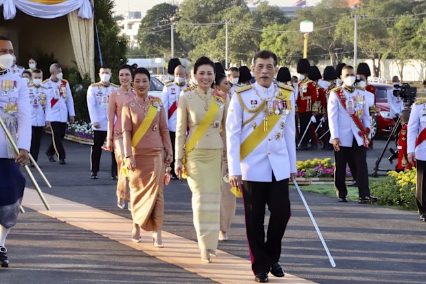Thailand's King Maha Vajiralongkorn followed by his wife Queen Suthida, and daughters Princess Bajrakitiyabha, centre left and Princess Sirivannavari. (Matichon Newspaper, Pool Photo via AP)