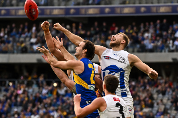 PERTH, AUSTRALIA - JULY 30: Ben McKay of the Kangaroos spoils in a marking contest during the 2023 AFL Round 20 match between the West Coast Eagles and the North Melbourne Kangaroos at Optus Stadium on July 30, 2023 in Perth, Australia. (Photo by Daniel Carson/AFL Photos via Getty Images)