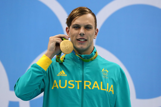 An 18-year-old Kyle Chalmers poses with his gold medal at the 2016 Rio Olympics