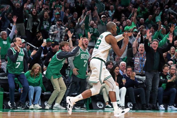 Boston, MA - May 17: Boston Celtics C Al Horford signals to the Miami Heat bench that they should call a timeout after he hit a 3-pointer in the second quarter. The Celtics lost to the Heat, 123-116, in Game 1 of the 2023 Eastern Conference Finals. (Photo by Jim Davis/The Boston Globe via Getty Images)