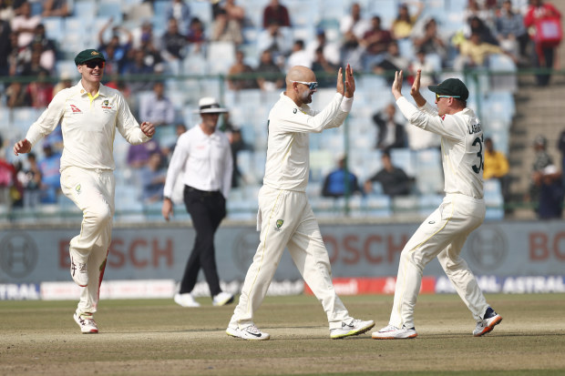 Nathan Lyon of Australia celebrates the wicket of Rohit Sharma of India.