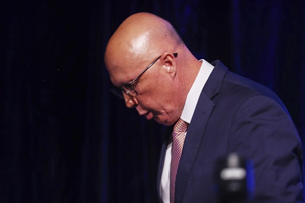 Australian Liberal Party leader Peter Dutton walks from the stage after making a concession speech