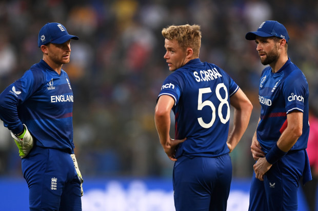 Jos Buttler, Sam Curran and Chris Woakes of England in Delhi.