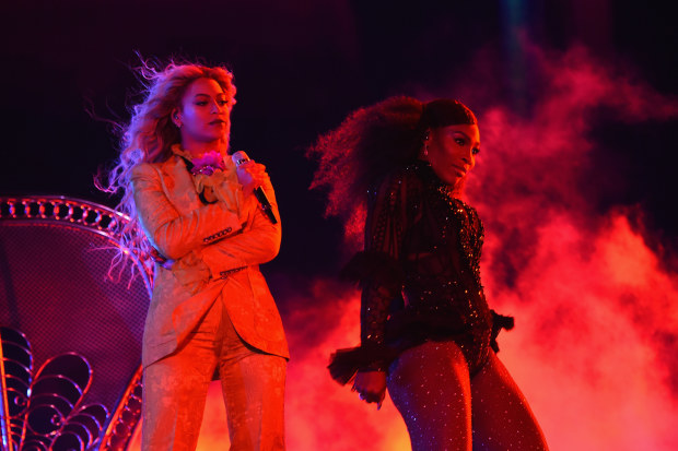 Serena Williams (right) with entertainer Beyonce on stage during closing night of "The Formation World Tour" at MetLife Stadium in 2016.
