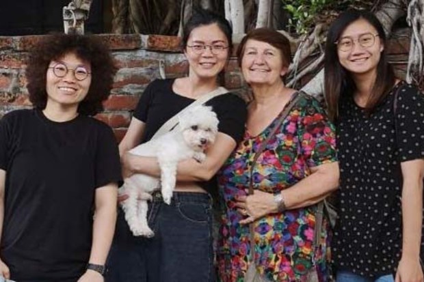 Lindy Cleeland, 67, with some of the travellers she has hosted on Abroadly.