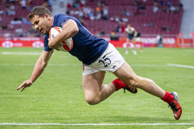 Antoine Dupont of France scores a try against Great Britain.