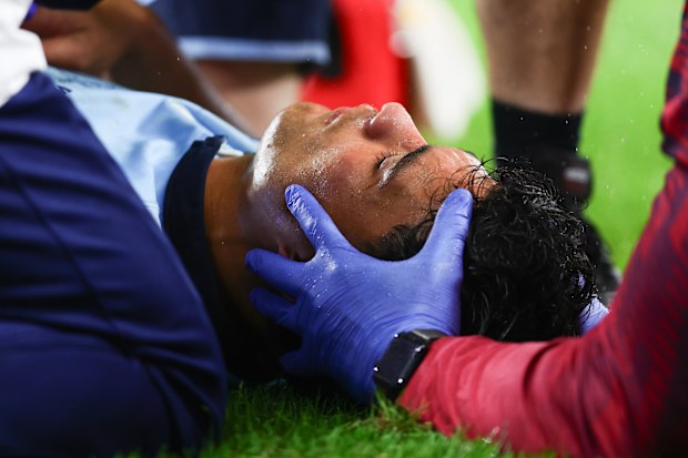SYDNEY, AUSTRALIA - MAY 09: Joseph-Aukuso Suaalii of the Waratahs is treated by medical staff and fitted with a neck brace during the Super Rugby Pacific match between Waratahs v Queensland Reds at the Allianz Stadium on May 09, 2025 in Sydney, Australia. (Photo by Pete Dovgan/Speed Media/Icon Sportswire via Getty Images)