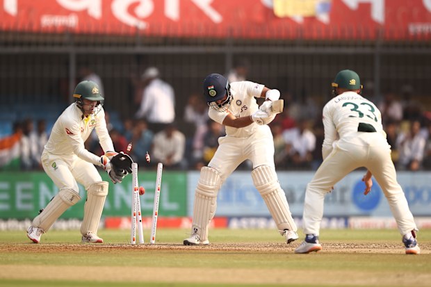 Cheteshwar Pujara of India is bowled by Nathan Lyon of Australia during day one in Indore, India. (Photo by Robert Cianflone/Getty Images)