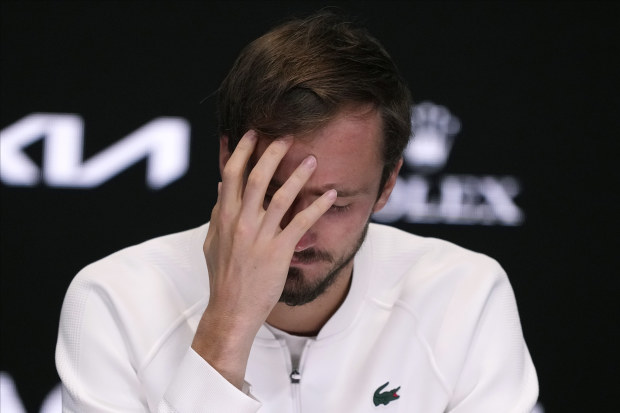 Daniil Medvedev winces after losing the Australian Open final to Jannik Sinner in a five-set thriller.