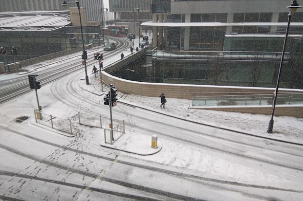Crunchy underfoot as London's workers head to the office. Picture: AAP