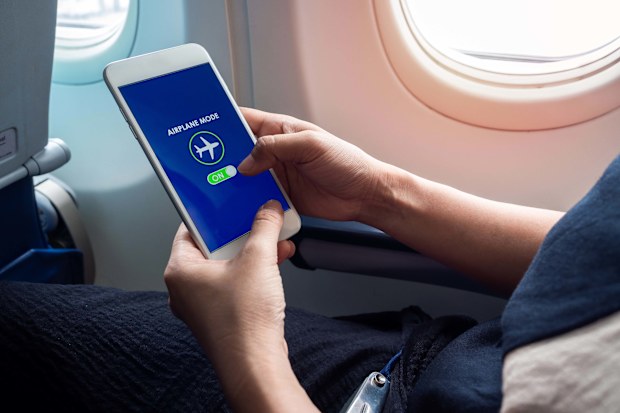 An airline pilot has revealed why passengers must put their phones on airplane mode when flying.