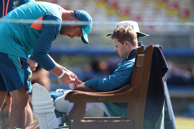 Steve Smith of Australia reacts after being struck on the finger in the nets during a session at Edgbaston.