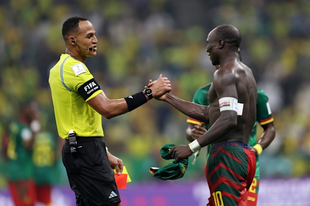 Referee Ismail Elfath shows a red card to Vincent Aboubakar of Cameroon after they scored their sides first goal during the FIFA World Cup Qatar 2022 Group G match between Cameroon and Brazil at Lusail Stadium on December 02, 2022 in Lusail City, Qatar. (Photo by Clive Brunskill/Getty Images)