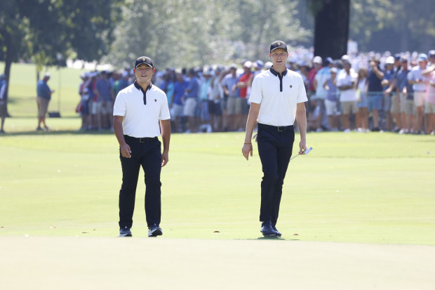 International Presidents Cup golfers Si Woo Kim on left and Cam Davis on right walk the 3rd hole during the 2022 Presidents Cup on September 22, 2022 at Quail Hollow Club in Charlotte, North Carolina. (Photo by Brian Spurlock/Icon Sportswire via Getty Images)
