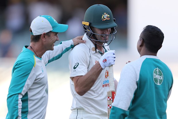 Joe Burns of Australia is congratulated by Justin Langer.