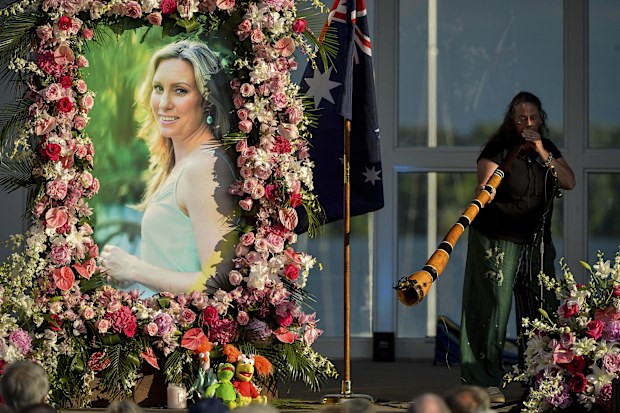  Johanna Morrow plays the didgeridoo during a memorial service for Justine Ruszczyk Damond at Lake Harriet in Minneapolis