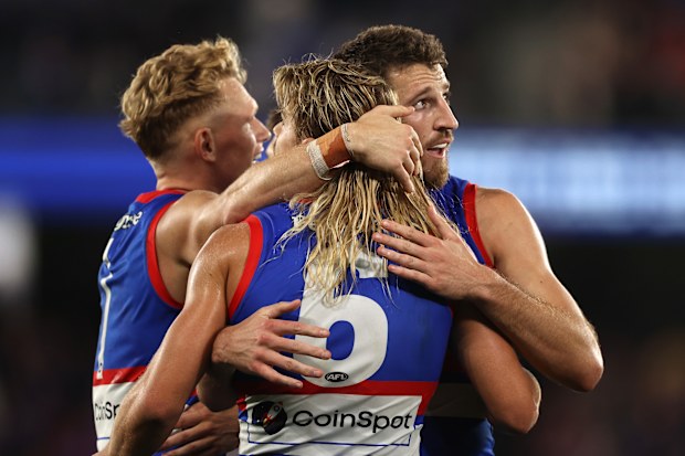 Bailey Smith, Marcus Bontempelli embrace during a game in 2022.