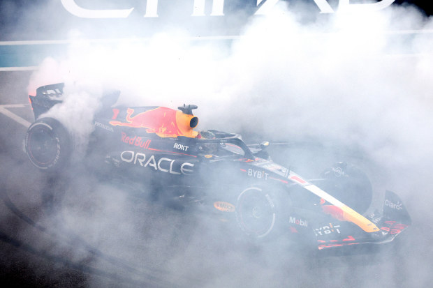 Race winner Max Verstappen of the Netherlands driving the (1) Oracle Red Bull Racing RB19 performs donuts on track during the F1 Grand Prix of Abu Dhabi at Yas Marina Circuit on November 26, 2023 in Abu Dhabi, United Arab Emirates. (Photo by Clive Rose/Getty Images)