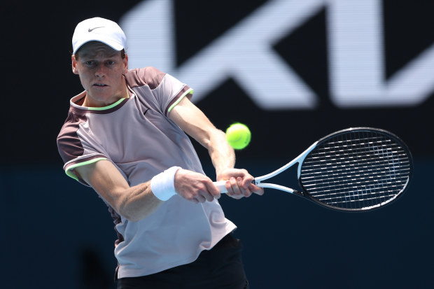 Jannik Sinner of Italy plays a backhand in his round one singles match against Botic van de Zandschulp of the Netherlands at the Australian Open.