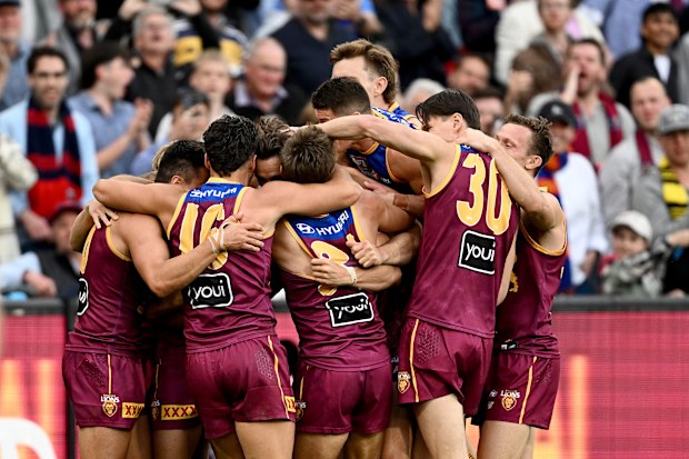 Joe Daniher of the Lions celebrates kicking a goal in the final minutes with team mates during the AFL Grand Final match between Sydney Swans and Brisbane Lions at Melbourne Cricket Ground, on September 28, 2024, in Melbourne, Australia. (Photo by Quinn Rooney/Getty Images)