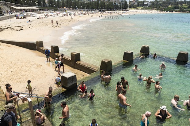 People enjoy the summer weather at Coogee beach.