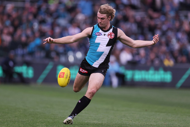ADELAIDE, AUSTRALIA - AUGUST 13: Jason Horne-Francis of the Power kicks the ball during the 2023 AFL Round 22 match between the Port Adelaide Power and the GWS GIANTS at Adelaide Oval on August 13, 2023 in Adelaide, Australia. (Photo by James Elsby/AFL Photos via Getty Images)