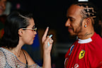NORTHAMPTON, ENGLAND - JULY 05: Lewis Hamilton of Great Britain and Scuderia Ferrari talks with Raye in the Paddock after qualifying ahead of the F1 Grand Prix of Great Britain at Silverstone Circuit on July 05, 2025 in Northampton, England. (Photo by Mario Renzi - Formula 1/Formula 1 via Getty Images)