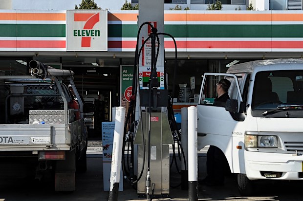 Customers fill their vehicles at the 7 Eleven Mobil petrol station on Liverpool Road in Ashfield, NSW. September 29, 2023. Photo: Kate Geraghty