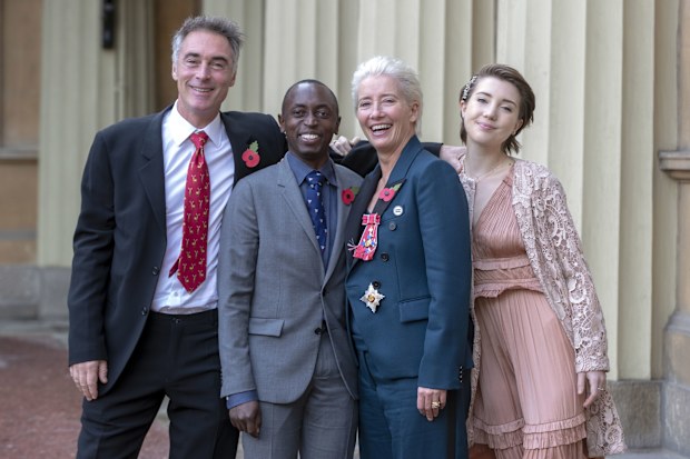 LONDON, ENGLAND - NOVEMBER 7:  Actress Emma Thompson, with her husband Greg Wise and children Gaia Wise and Tindy Agaba, leaves Buckingham Palace after she received her damehood at an Investiture ceremony on November 7, 2018 in London, England. Ms Thompson, 59, received the accolade in recognition of her services to drama. (Photo by Steve Parsons - WPA Pool/Getty Images)