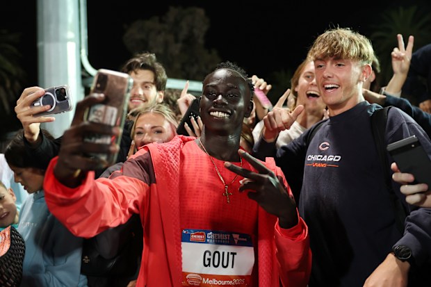MELBOURNE, AUSTRALIA - MARCH 29: Gout Gout of Queensland poses for a selfie with the crowd after coming second in the Peter Norman Mens 200m Final as part of the Maurie Pant Meet at Lakeside Stadium on March 29, 2025 in Melbourne, Australia. (Photo by Cameron Spencer/Getty Images)