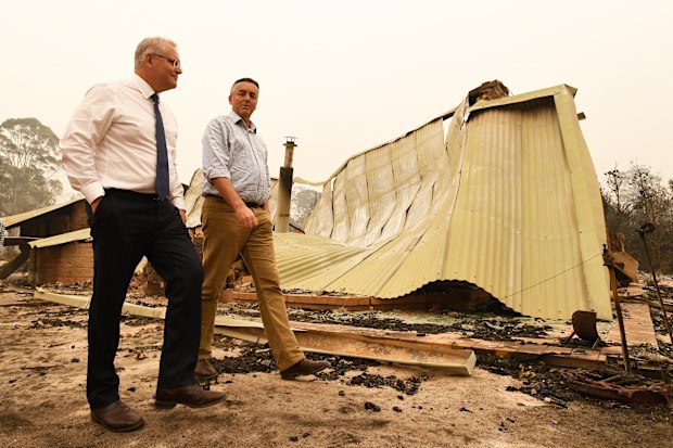Prime Minister Scott Morrison (L) and Darren Chester MP tour the Wildflower farm owned by Paul and Melissa Churchman on January 3, 2020 in Sarsfield, Victoria, Australia. (Photo by James Ross-Pool/Getty Images)