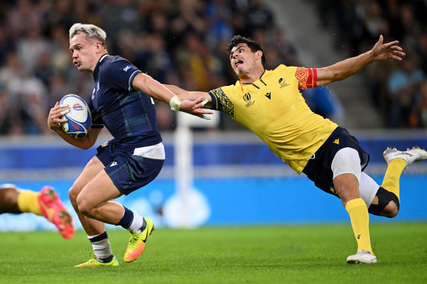 Darcy Graham of Scotland evades Marius Simionescu of Romania before scoring a try.