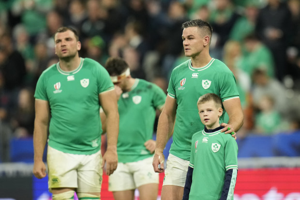 Ireland's Johnny Sexton with his son after their loss to New Zealand in the quarter-finals.