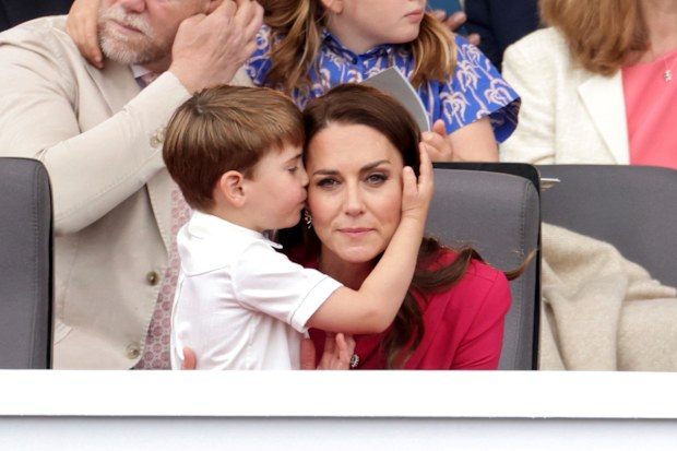 Prince Louis hugs Kate, Duchess of Cambridge, during the Platinum Jubilee Pageant held outside Buckingham Palace, in London, Sunday June 5, 2022, on the last of four days of celebrations to mark the Platinum Jubilee. 