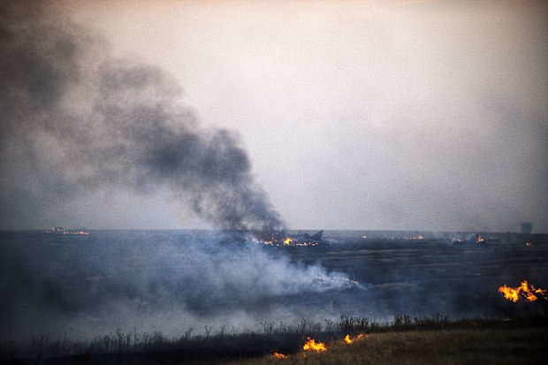 Smoke rises from a Ukrainian fighter jet shot down by pro-Russian rebels yesterday. (Getty Images) 