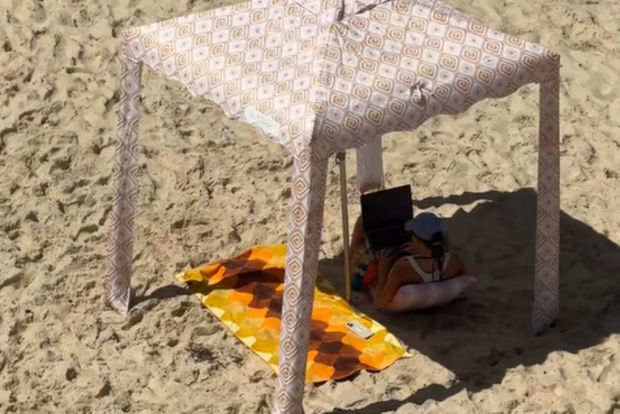 Remote worker working at the beach