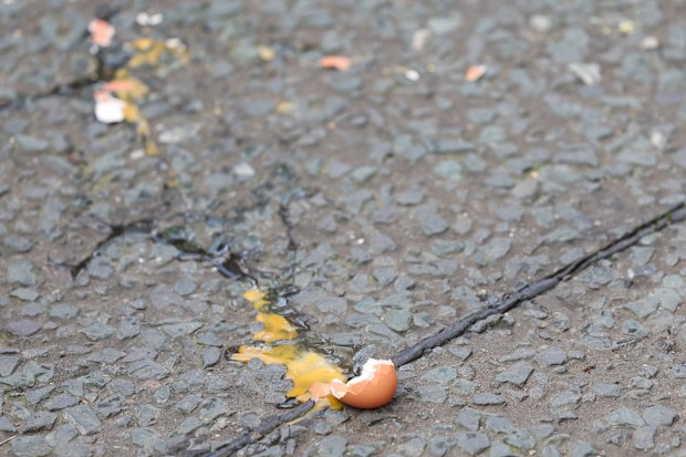 The broken egg thrown by a member of the public as King Charles III and Camilla, Queen Consort arrive for the Welcoming Ceremony to the City of York at Micklegate Bar during an official visit to Yorkshire on November 09, 2022 in York, England