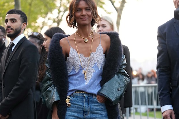 Model Liya Kebede at Paris Fashion Week 2025, wearing jeans and a lace camisole