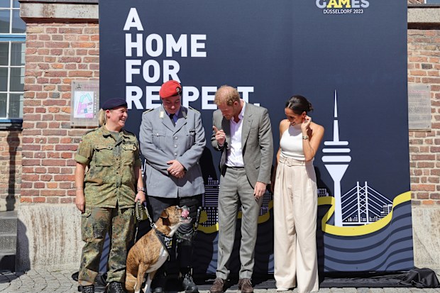 Prince Harry, Duke of Sussex and Meghan, Duchess of Sussex pose with competitors from the previous Invictus games during the Invictus Games Dusseldorf 2023 - One Year To Go events, on September 06, 2022 in Dusseldorf, Germany.  