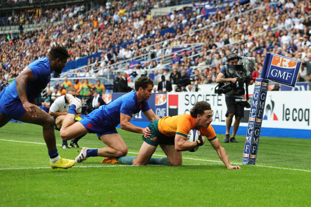 Mark Nawaqanitawase of Australia scores the team's first try during the against France at Stade de France.