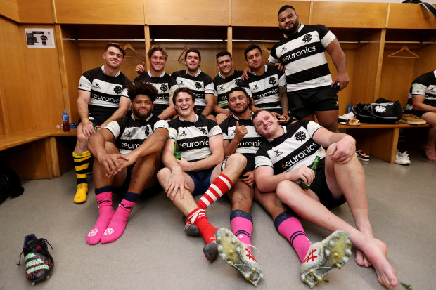 The Australian Barbarians pose for a photograph in the changing room.