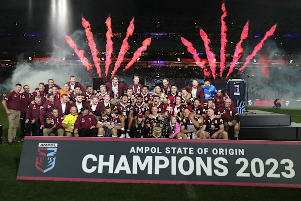 Queensland players and support staff celebrate series victory following game three of the State of Origin.