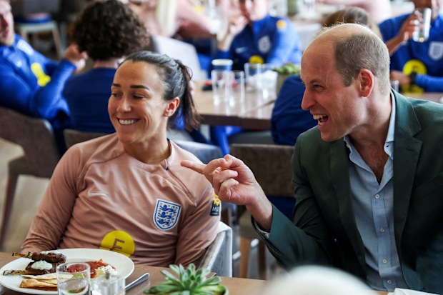 Prince William, Prince of Wales and President of The Football Association, talks to football player Lucy Bronze (L) as he visits England Women's team to wish them luck ahead of the 2023 FIFA Women's World Cup at St Georges Park on June 20, 2023 in Burton-upon-Trent, England. 