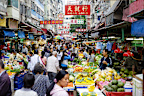A busy street produce market in Hong Kong, China.