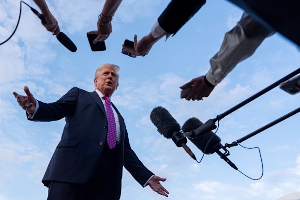 FILE - President Donald Trump speaks with reporters before he departs on Air Force One at Morristown Airport, Sunday, Sept. 14, 2025, in Morristown, N.J. (AP Photo/Alex Brandon, File)