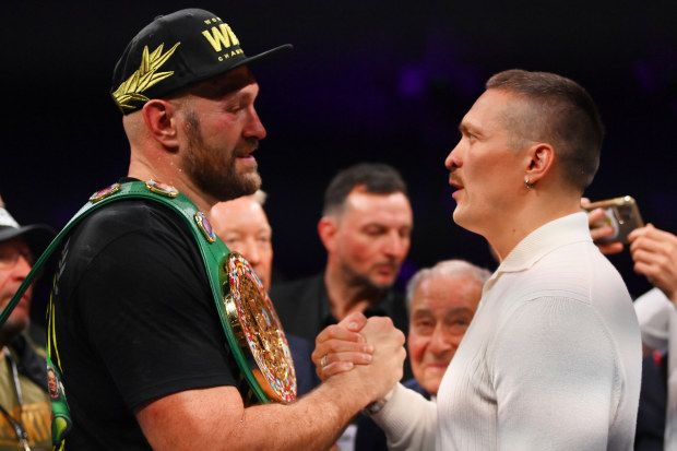 Tyson Fury and Oleksandr Usyk shake hands after the Heavyweight fight between Fury and Ngannou